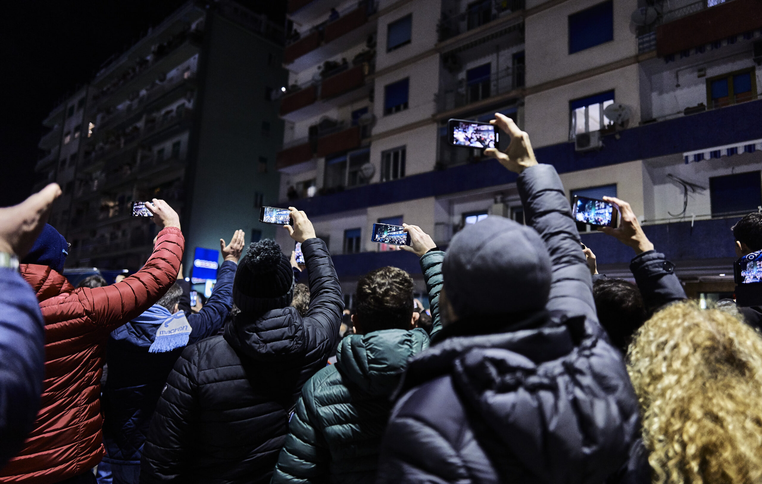 Supporters capturing the arrival at the stadium of Napoli players bus