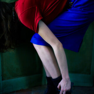 Roxane, red shirt, blue skirt, white dress.